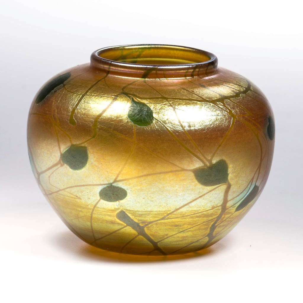 TIFFANY FAVRILE HEART AND VINE CABINET VASE: TIFFANY FAVRILE HEART AND VINE CABINET VASE, golden iridescent with green Heart and Vine decoration, polished pontil mark and base, signed "647 K L.C.Tiffany-Favrile." Tiffany Studios. Circa 1916. 2 3