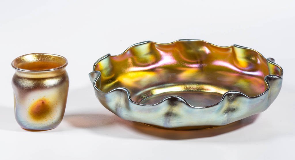 TIFFANY FAVRILE TABLE ARTICLES, LOT OF TWO: TIFFANY FAVRILE TABLE ARTICLES, LOT OF TWO, golden iridescent, comprising a scalloped bowl and a toothpick holder/cordial, bowl having a ribbed design, each with a polished base and pontil mark, and s