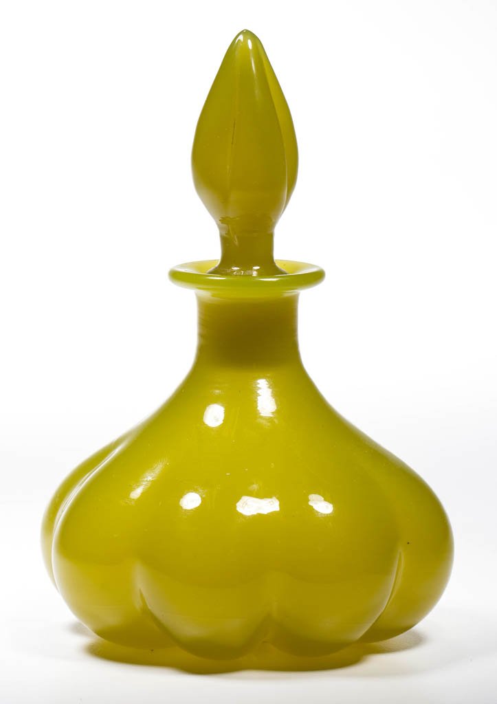 STEUBEN ART GLASS MELON-FORM COLOGNE BOTTLE: STEUBEN ART GLASS MELON-FORM COLOGNE BOTTLE, Yellow Jade, shape 1455, original lobed stopper numbered to match the bottle, polished pontil mark with original triangular paper label. Steuben Glass Work