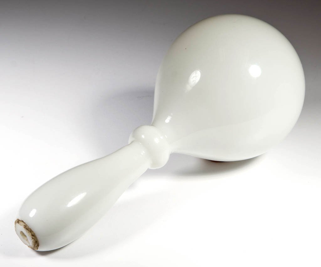 STEUBEN ART GLASS DARNING BALL: STEUBEN ART GLASS DARNING BALL, Flint White, handle with open-pontil end, not signed. Steuben Glass Works. Circa 1920-1930. 7" L.