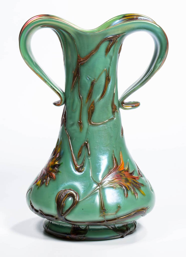 LOETZ-TYPE ART GLASS PULLED BUTTRESS VASE: LOETZ-TYPE ART GLASS PULLED BUTTRESS VASE, green, with multi-colored decoration on the interior and applied to the exterior, base has a polished pontil mark. Possibly Kralik. Early 20th century. 7 3/4