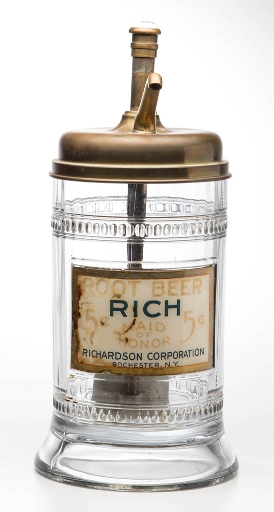 RICHARDSON "MAID OF HONOR" FIVE-CENT ROOT BEER GLASS: RICHARDSON "MAID OF HONOR" FIVE-CENT ROOT BEER GLASS SYRUP DISPENSER, molded cylindrical form with slightly flared foot and original label. Retains period pump marked "Maid of Honor". Early 20th centu