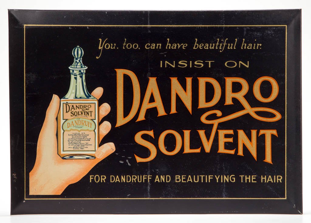 DANDRO BARBERSHOP TIN ADVERTISING SIGN: DANDRO BARBERSHOP TIN ADVERTISING SIGN, "You, too, can have beautiful hair" above logo and image of hand holding bottle. Retains original cardboard back marked for "Elwood Myers Co. / Springfield, Ohi