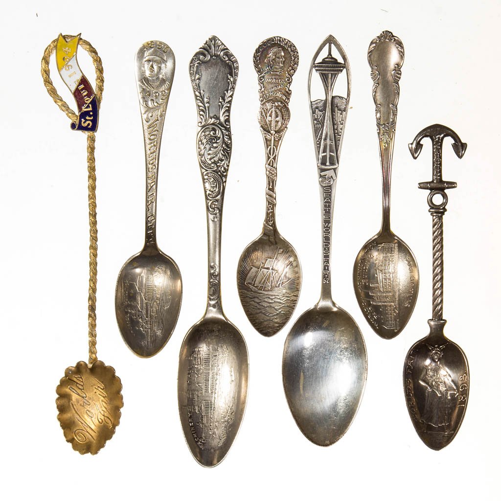 ASSORTED WORLD'S FAIR / EXPOSITION SOUVENIR SPOONS, LOT: ASSORTED WORLD'S FAIR / EXPOSITION SOUVENIR SPOONS, LOT OF SEVEN, including sterling silver examples from the Columbian Exposition 1893, the Seattle World's Fair 1962, the St. Louis Exposition 1904 "W