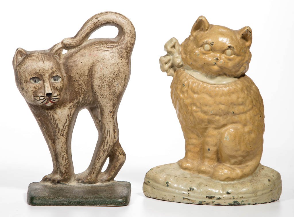 ASSORTED FIGURAL CAT CAST-IRON DOORSTOPS, LOT OF TWO: ASSORTED FIGURAL CAT CAST-IRON DOORSTOPS, LOT OF TWO, each half figure, one in original paint, the other repainted. 20th century. 7 3/4" and 8" H. Provenance: From the Dorothy R. Daniel estate, Arling