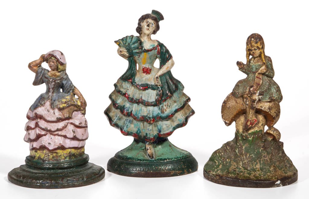 ASSORTED FIGURAL FEMALE CAST-IRON DOORSTOPS, LOT OF: ASSORTED FIGURAL FEMALE CAST-IRON DOORSTOPS, LOT OF THREE, each half figure, including Little Miss Muffet and Hubley No. 193 Spanish Girl, each in old paint. First half 20th century. 7" to 9" H. Prove
