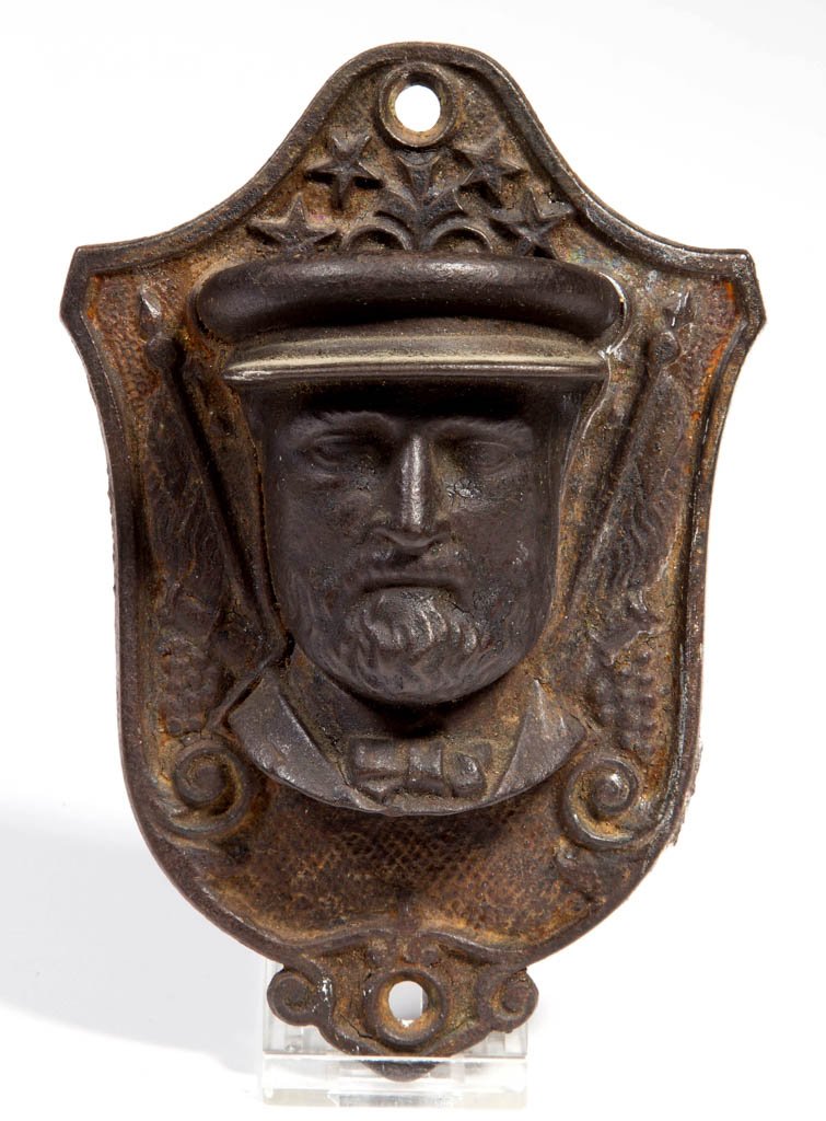 FIGURAL CAST-IRON U. S. GRANT MATCH HOLDER / SAFE: FIGURAL CAST-IRON U. S. GRANT MATCH HOLDER / SAFE, wall mount, bust image with striker feature below collar, back with traces of original paper label "PAT APPLIED FOR". Fourth quarter 19th century. 4"