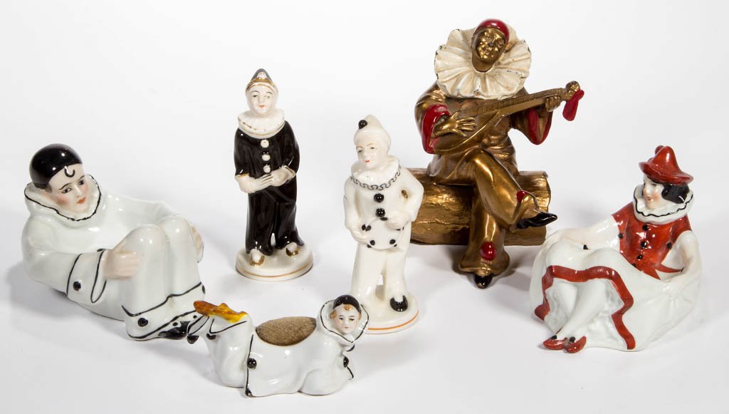 ASSORTED FIGURAL CLOWN ARTICLES, LOT OF SIX: ASSORTED FIGURAL CLOWN ARTICLES, LOT OF SIX, comprising a German china ashtray and pin cushion, an unmarked china ashtray, a pair of Occupied Japan china figures, and a K&O Co. metal figure. First hal