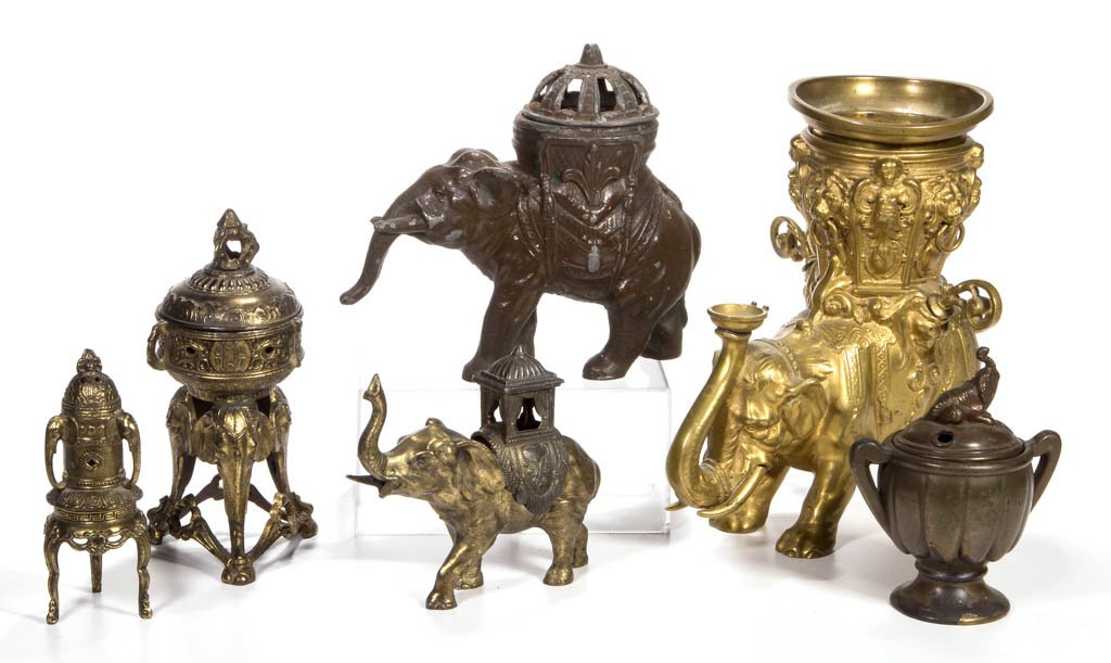 ASSORTED METAL FIGURAL ELEPHANT ARTICLES, LOT OF SIX: ASSORTED METAL FIGURAL ELEPHANT ARTICLES, LOT OF SIX, comprising a heavy brass cigar lighter with two removable lighters, and five incense burners, three of which are marked France. Late 19th/first ha