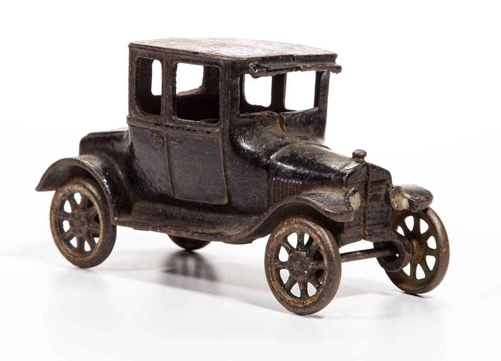 ARCADE MODEL T CAST-IRON COUPE: ARCADE MODEL T CAST-IRON COUPE, marked on interior, with original paint, lacking driver. First quarter 20th century. 6 1/2" L. Provenance: From the Ed & Kay Winnick collection, Sidney, NY.