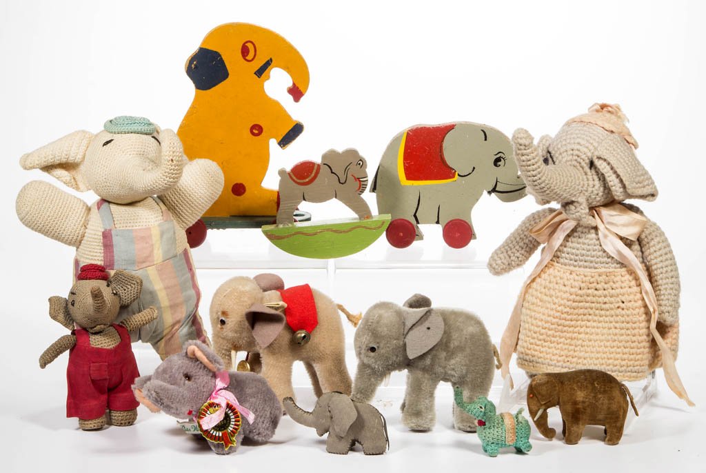 ASSORTED ELEPHANT THEME TOYS, LOT OF 12: ASSORTED ELEPHANT THEME TOYS, LOT OF 12, including Hermann and Steiff examples, fabric dolls, and wooden examples on wheels. 20th century. 1 3/4" to 9" H. Provenance: From the Dorothy R. Daniel estate