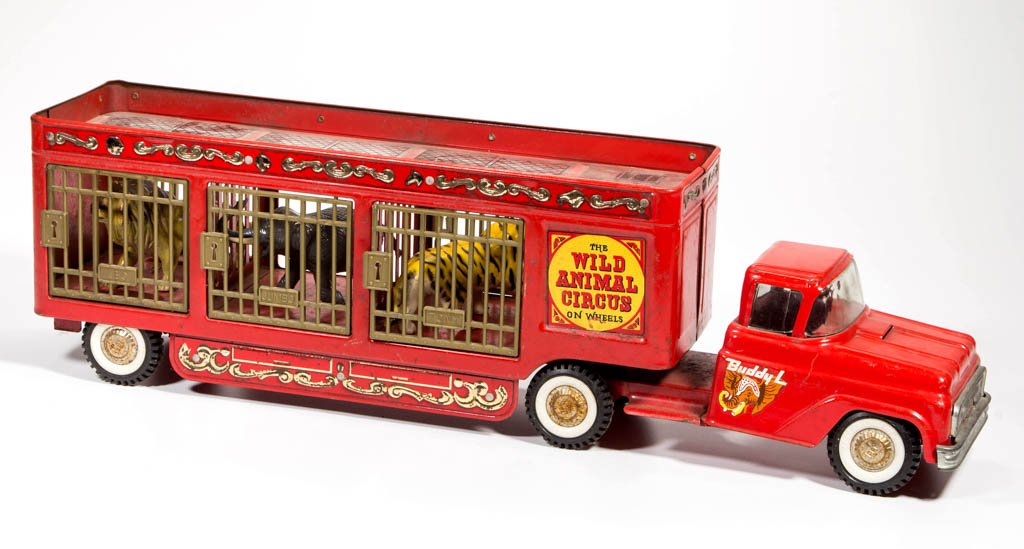 BUDDY-L WILD ANIMAL CIRCUS PRESSED-STEEL TRUCK: BUDDY-L WILD ANIMAL CIRCUS PRESSED-STEEL TRUCK, with original plastic roof cover and three animals. Mid 20th century. 26" L. Provenance: From the Ed & Kay Winnick collection, Sidney, NY.