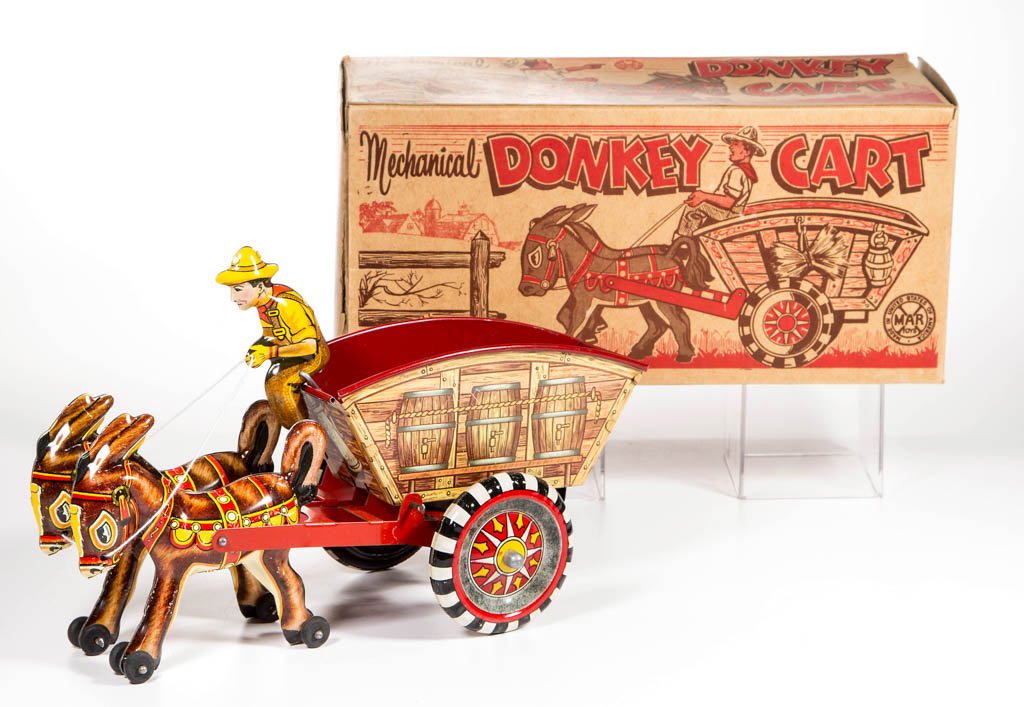 MARX "DONKEY CART" TIN WIND-UP TOY: MARX "DONKEY CART" TIN WIND-UP TOY, with two donkeys and single rider, in original box. Original paint. Circa 1950. 6 1/2" HOA, 10 1/4" L. Provenance: Property of a Virginia private collector.