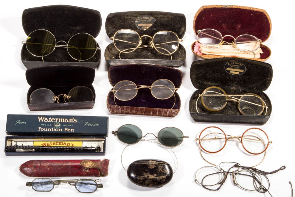 VINTAGE EYE GLASSES / SPECTACLES AND OTHER ARTICLES,: VINTAGE EYE GLASSES / SPECTACLES AND OTHER ARTICLES, LOT OF 12, including two pair of eye glasses with colored lenses, a Waterman Ideal black fountain pen with original box and instructions, and a snu