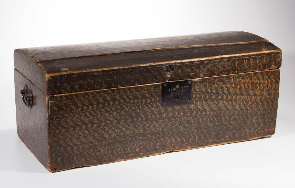NEW ENGLAND PAINTED POPLAR DOME-TOP TRUNK: NEW ENGLAND PAINTED POPLAR DOME-TOP TRUNK, dovetailed construction, original iron lock and end handles. Original sponge-decorated paint. First quarter 19th century. 11" H, 26 1/2" x 12". Provenance: P