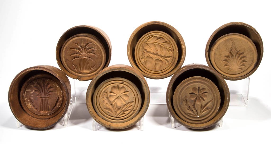 AMERICAN TREEN BUTTER MOLDS, LOT OF SIX: AMERICAN TREEN BUTTER MOLDS, LOT OF SIX, each of round form, assorted flower, acorn, and sheaf of wheat stamps. Late 19th/first quarter 20th century. 4 1/2" D. Provenance: From a Page Co., VA private 