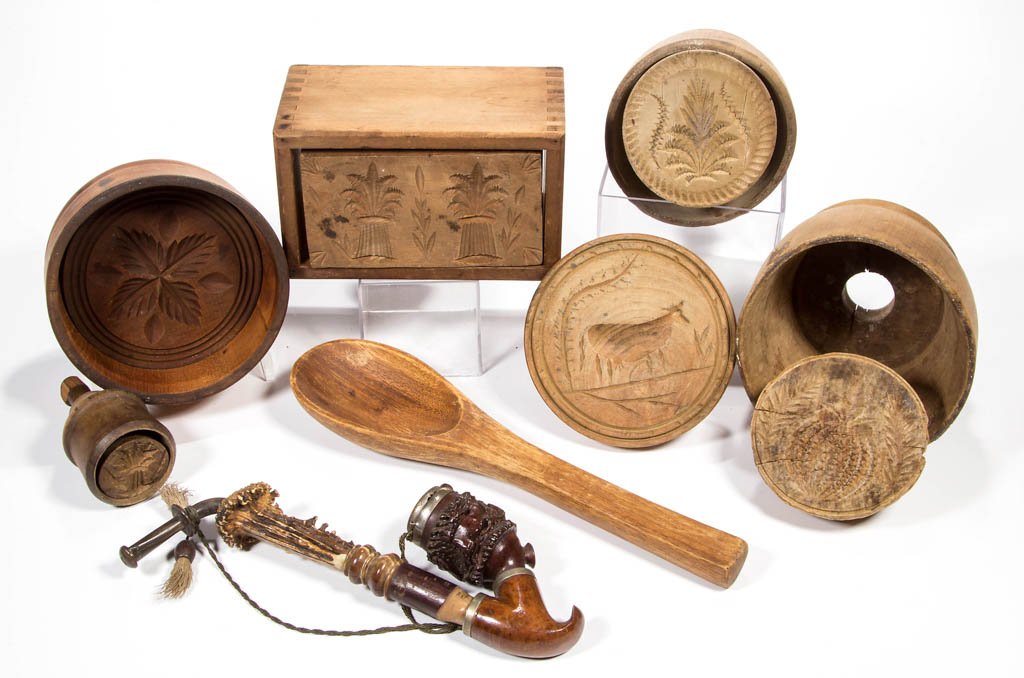 AMERICAN TREEN BUTTER MOLDS / PRINTS, LOT OF SIX: AMERICAN TREEN BUTTER MOLDS / PRINTS, LOT OF SIX, comprising a rectangular form with double sheaf of wheat, and five round with assorted designs. Together with a treen spoon and Black Forest pipe. Eig