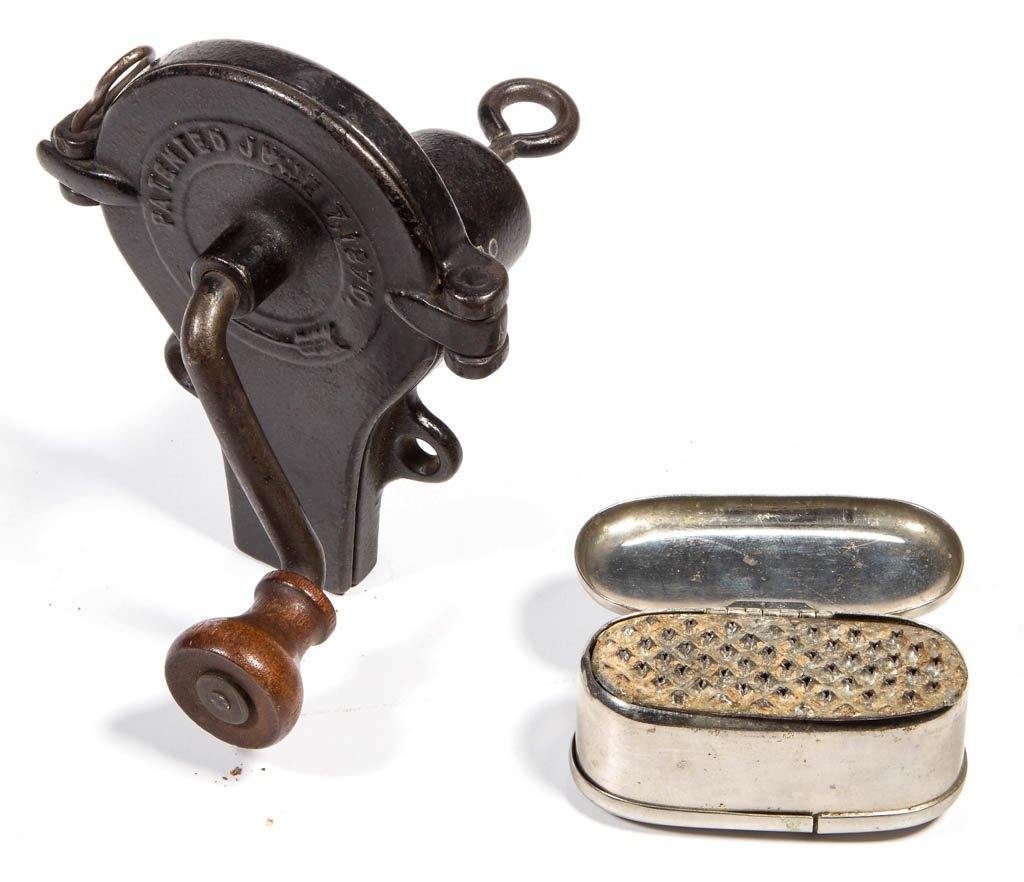 ASSORTED METAL NUTMEG GRATERS, LOT OF TWO: ASSORTED METAL NUTMEG GRATERS, LOT OF TWO, comprising a nickel-plated ovoid-form example, hinged covers on each side, interior fitted with a grater plate; and a cast-iron patented hand-crank example,