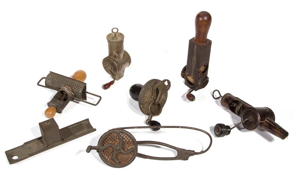 ASSORTED SHEET-IRON AND CAST-IRON NUTMEG GRATERS, LOT: ASSORTED SHEET-IRON AND CAST-IRON NUTMEG GRATERS, LOT OF SEVEN, comprising five hand-crank examples, including a vertical example marked "MTE", a japanned finish example marked "THE RAPID", another wi