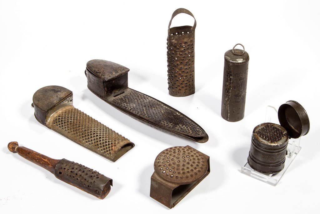 ASSORTED SHEET-IRON NUTMEG GRATERS, LOT OF SEVEN: ASSORTED SHEET-IRON NUTMEG GRATERS, LOT OF SEVEN, hand-held examples, including two with hinged storage compartment and japanned finish, two with graters fitted in cylinder-form container, and a woode