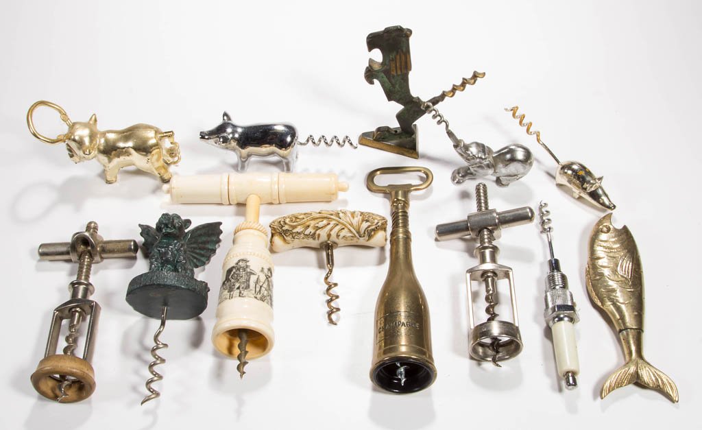 ASSORTED METAL AND COMPOSITION FIGURAL AND MECHANICAL: ASSORTED METAL AND COMPOSITION FIGURAL AND MECHANICAL CORKSCREWS, LOT OF 13, including a brass fish and a Judaica-style lion, faux bone/scrimshaw examples, two pigs and an elephant. 20th century. 4 1/