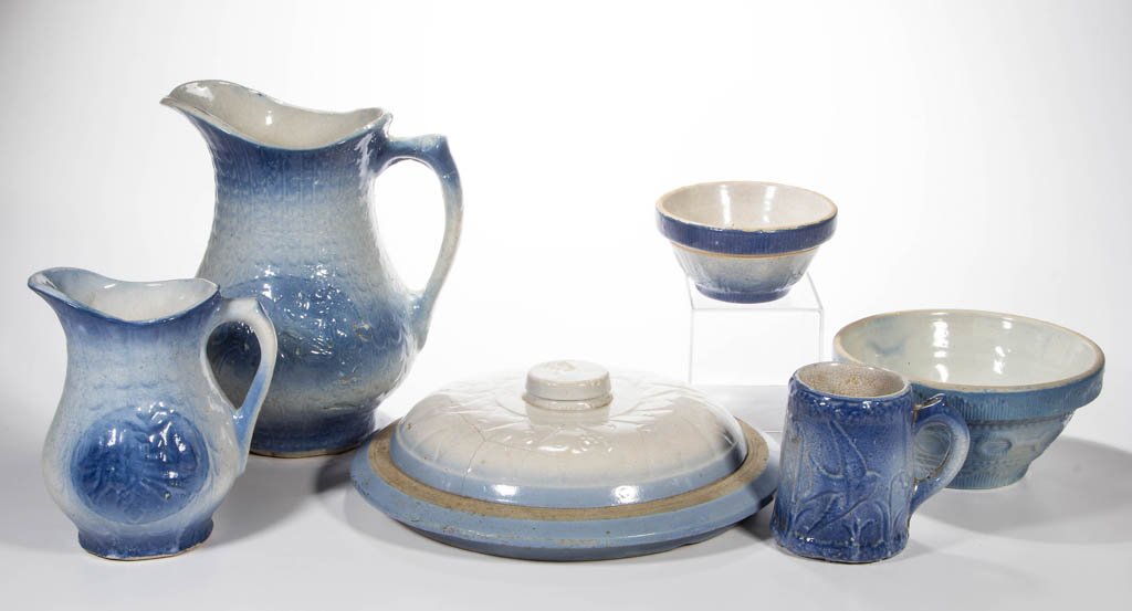 ASSORTED BLUE AND WHITE SALT-GLAZED CERAMIC ARTICLES,: ASSORTED BLUE AND WHITE SALT-GLAZED CERAMIC ARTICLES, LOT OF SIX, comprising a Fish Scale and Floral large pitcher, Fish Scale small pitcher, Flying Birds mug, large cover with geometric design, small