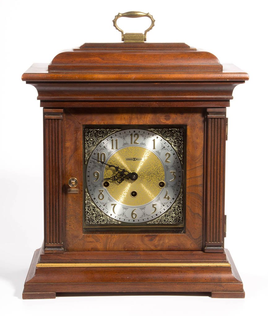 HOWARD MILLER BRACKET-STYLE SHELF CLOCK: HOWARD MILLER BRACKET-STYLE SHELF CLOCK, cherry case, Westminster chimes. 20th century. Case 16 1/2" H. Provenance: From a Page Co., VA private collection.