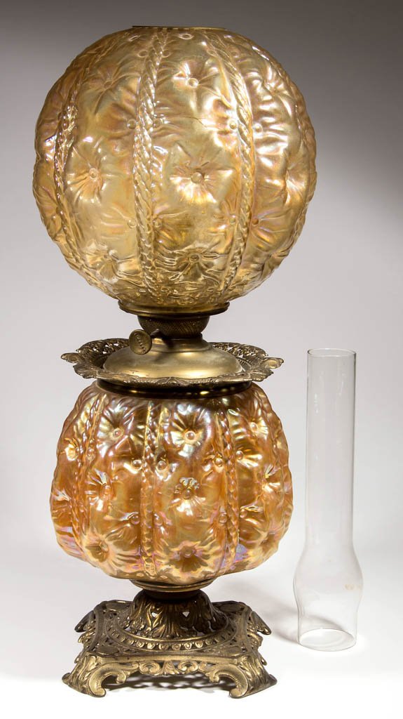PITTSBURGH "SUNKEN HOLLYHOCK / BUTTON TUFTED" CARNIVAL: PITTSBURGH "SUNKEN HOLLYHOCK / BUTTON TUFTED" CARNIVAL GLASS PARLOR LAMP, marigold iridescent, matching patterned ball-form shade with brass trim ring, tapered-globular form glass font holder, fitted 