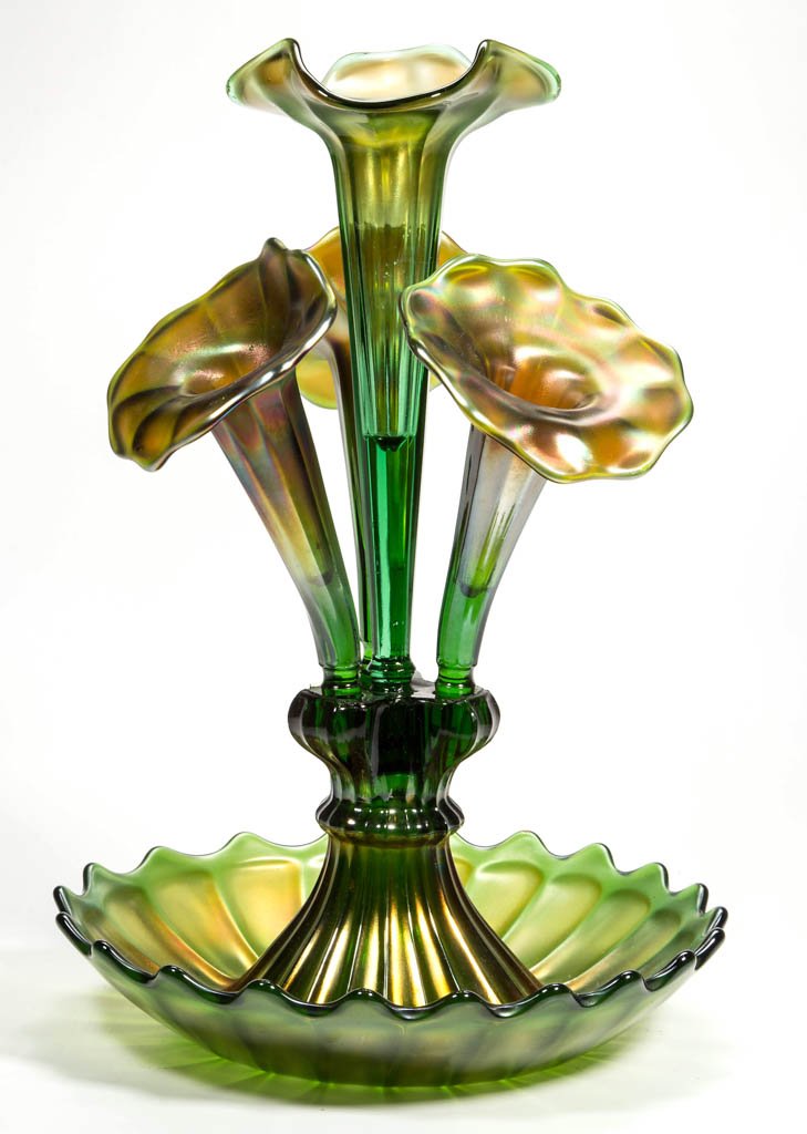 NORTHWOOD "WIDE PANEL" CARNIVAL GLASS EPERGNE: NORTHWOOD "WIDE PANEL" CARNIVAL GLASS EPERGNE, green iridescent, circular scalloped rim base supporting four trumpets/lily's, faint maker's mark in the base. Northwood Glass Co. Circa 1909. 16 1/4" HO