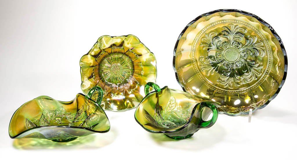 ASSORTED MILLERSBURG CARNIVAL GLASS BOWLS, LOT OF FOUR: ASSORTED MILLERSBURG CARNIVAL GLASS BOWLS, LOT OF FOUR, green and dark green iridescent, comprising a Mayan ice cream, a Cosmos sauce, tri-corner Holly nappy with single handle, and a Holly Sprig bonb