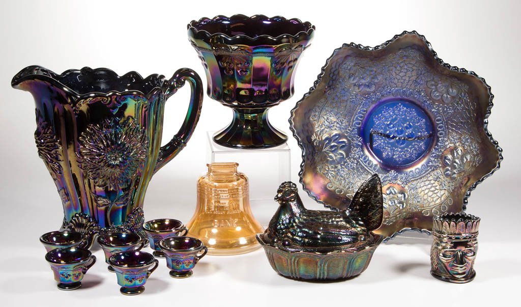ASSORTED CARNIVAL GLASS ARTICLES, LOT OF 12: ASSORTED CARNIVAL GLASS ARTICLES, LOT OF 12, amethyst, blue and marigold iridescent, comprising a figural Indian chief toothpick holder, a Fenton hen on the nest covered dish, a Cherry Chain bowl with