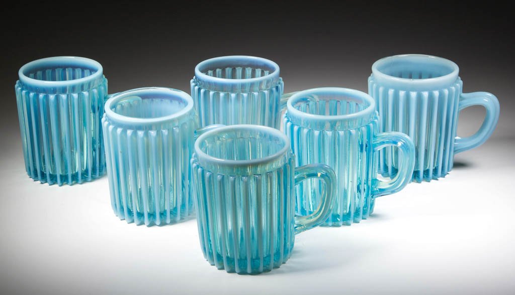 BEATTY RIB MUGS, LOT OF SIX: BEATTY RIB MUGS, LOT OF SIX, blue opalescent. A. J. Beatty & Sons. Circa 1889. 3" H. Literature: Parallels Heacock/Elmore - Opalescent Glass From A-Z, p. 120, fig. 129. Provenance: From the collection
