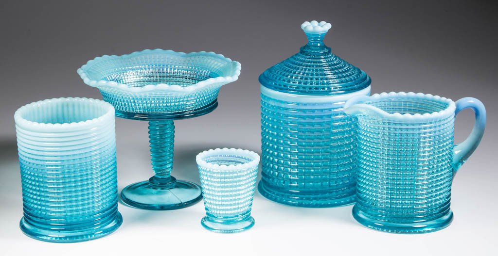 RIBBED SPIRAL TABLE ARTICLES, LOT OF FIVE: RIBBED SPIRAL TABLE ARTICLES, LOT OF FIVE, blue opalescent, comprising a covered sugar, jelly compote, toothpick holder, creamer, and spooner. Model Flint Glass Co. Circa 1903. 2 1/8" to 6 1/4" HOA. L