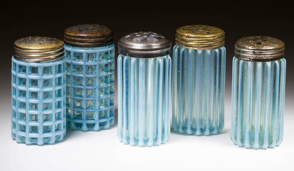 ASSORTED BEATTY SALT AND PEPPER SHAKERS, LOT OF FIVE: ASSORTED BEATTY SALT AND PEPPER SHAKERS, LOT OF FIVE, blue and colorless opalescent, comprising two Beatty Honeycomb and three Beatty Rib examples, period lids. A. J. Beatty & Sons. Circa 1889. 2 7/8"