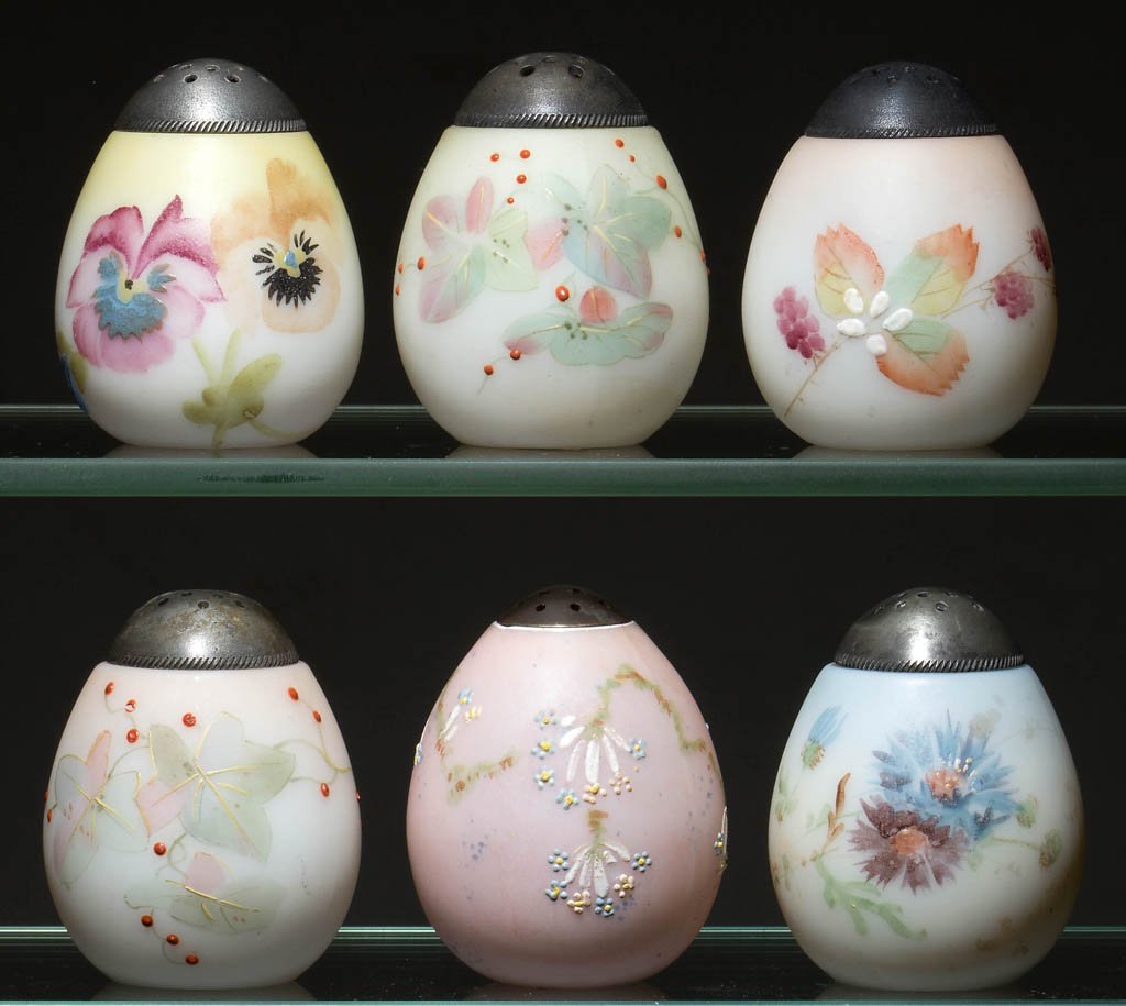 MT. WASHINGTON EGG SALT AND PEPPER SHAKERS, LOT OF SIX: MT. WASHINGTON EGG SALT AND PEPPER SHAKERS, LOT OF SIX, opal with various grounds and polychrome-enamel foliate decorations, including one Ostrich Egg example, plush/satin finish, period lids. Mt. Was