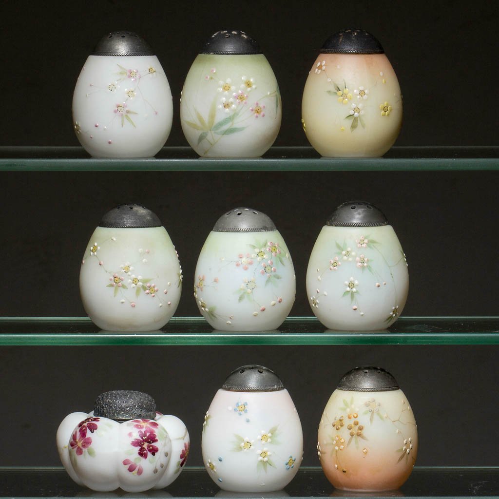 MT. WASHINGTON FIGURAL SALT AND PEPPER SHAKERS, LOT OF: MT. WASHINGTON FIGURAL SALT AND PEPPER SHAKERS, LOT OF NINE, opal with various grounds and polychrome-enamel floral decorations, comprising eight eggs and one tomato, plush/satin finish, period lids. 