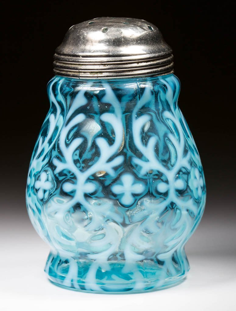 OPALINE BROCADE / SPANISH LACE SUGAR SHAKER: OPALINE BROCADE / SPANISH LACE SUGAR SHAKER, blue opalescent, with period lid. Northwood Glass Co. Circa 1899. 4 5/8" HOA. Literature: Parallels Heacock/Elmore - Opalescent Glass From A-Z, p. 161, fig
