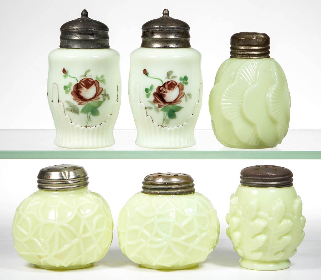 ASSORTED CUSTARD GLASS SHAKERS, LOT OF SIX: ASSORTED CUSTARD GLASS SHAKERS, LOT OF SIX, including two Ribbed Drape with polychrome decoration, two Spider Web, and a Sunset example, each with a period lid. Late 19th/early 20th century. 2 1/2" to