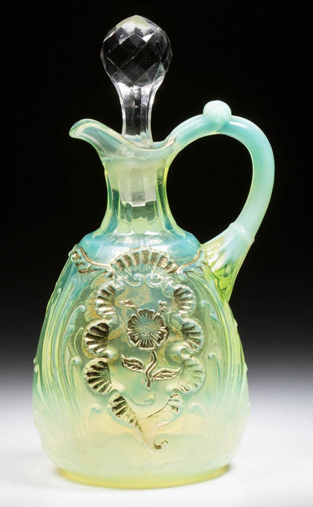 CARNELIAN (OMN) / EVERGLADES CRUET: CARNELIAN (OMN) / EVERGLADES CRUET, vaseline (uranium) opalescent with gilt decoration, period stopper. Northwood Glass Co. Circa 1903. 7" HOA. Literature: Heacock - Victorian Colored Pattern Glass, B