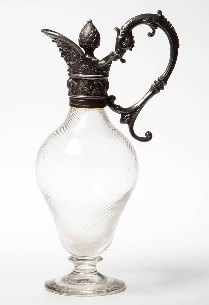 VICTORIAN FINE RIB SWIRL CRUET: VICTORIAN FINE RIB SWIRL CRUET, colorless, ornate white-metal mount with serpent handle, polished pontil mark. Fourth quarter 19th century. 7 3/4" HOA. Provenance: From the private collection of Rick 