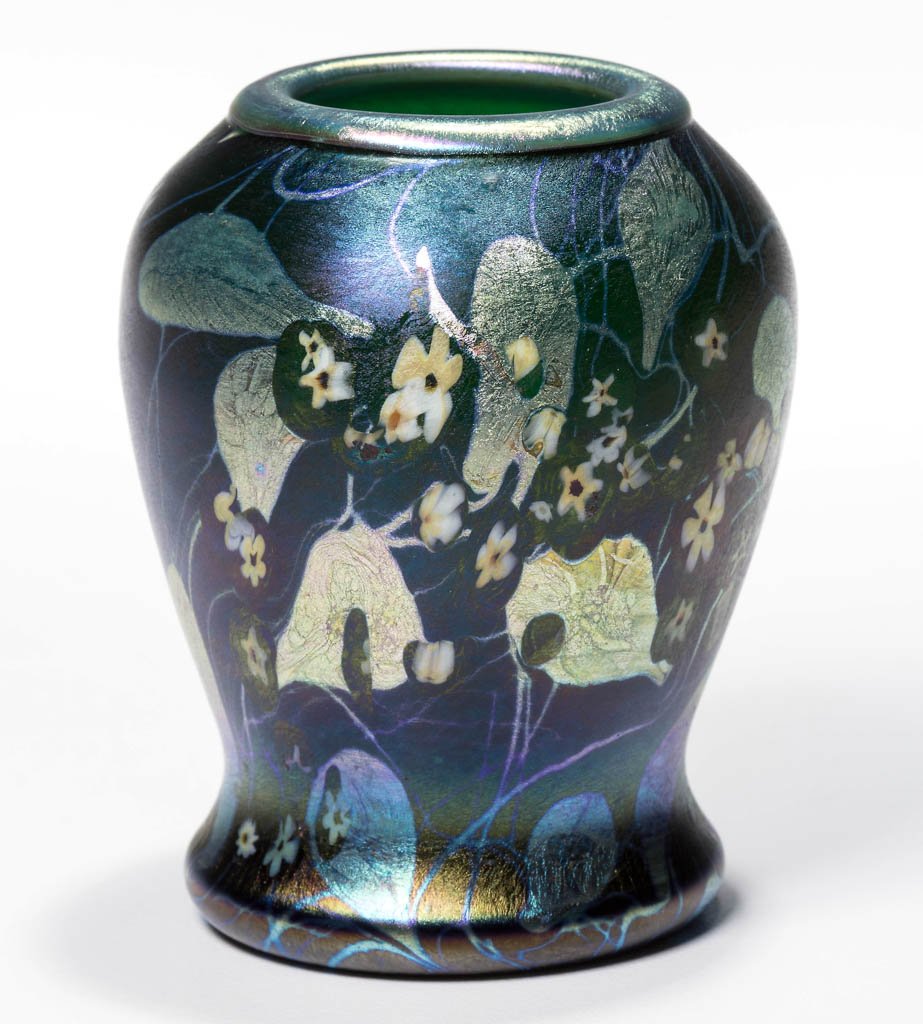TIFFANY FAVRILE MILLEFIORI CABINET VASE / TOOTHPICK: TIFFANY FAVRILE MILLEFIORI CABINET VASE / TOOTHPICK HOLDER, green with iridescent and millefiori decoration, signed "5921E L.C.Tiffany Favrile," polished base and pontil mark. 1910. 2 5/8" H. Provenan