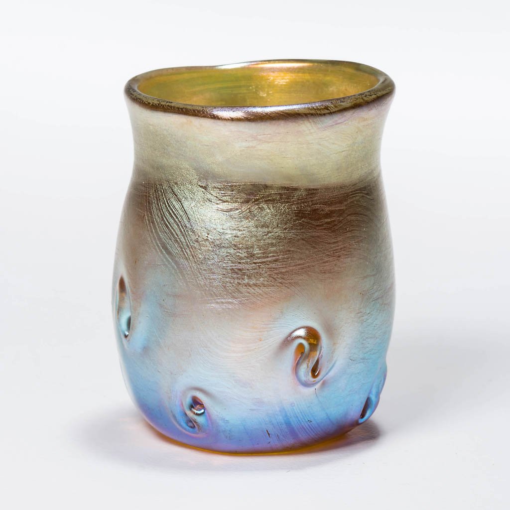 TIFFANY FAVRILE PIGTAIL PRUNTS TOOTHPICK HOLDER /: TIFFANY FAVRILE PIGTAIL PRUNTS TOOTHPICK HOLDER / LIQUOR TUMBLER, gold iridescent, signed "L.C.T.", polished base and pontil mark. Late 19th/early 20th century. 1 3/4" H. Literature: Steeg - Tiffany F