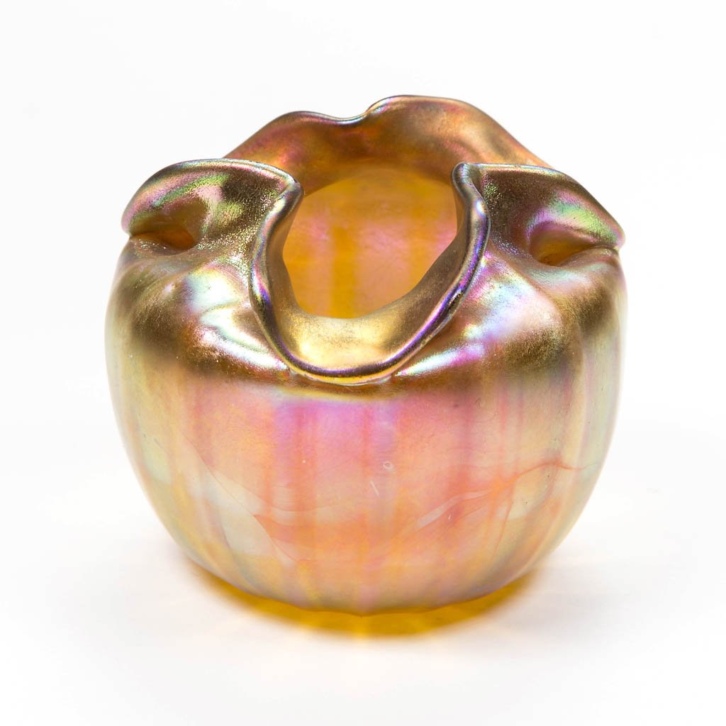 QUEZAL ART GLASS TOOTHPICK HOLDER: QUEZAL ART GLASS TOOTHPICK HOLDER, golden iridescent, vertical ribs and fluted rim, polished pontil mark signed "Quezal." First quarter 20th century. 2" H, 2 1/2" DOA. Literature: Toothpick Holders: C