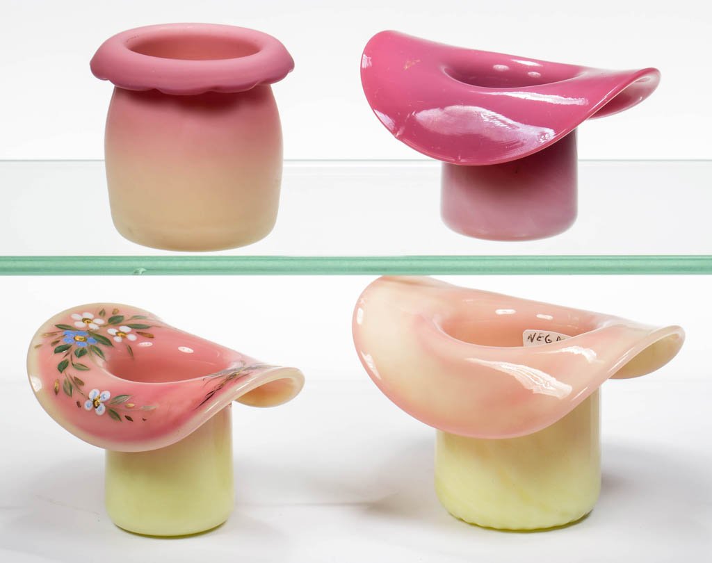 ASSORTED PAIRPOINT TOOTHPICK HOLDERS, LOT OF FOUR: ASSORTED PAIRPOINT TOOTHPICK HOLDERS, LOT OF FOUR, Burmese and Peachblow, comprising a barrel-form and three hat-form examples, one with dragonfly and floral polychrome decoration, each with a rough p