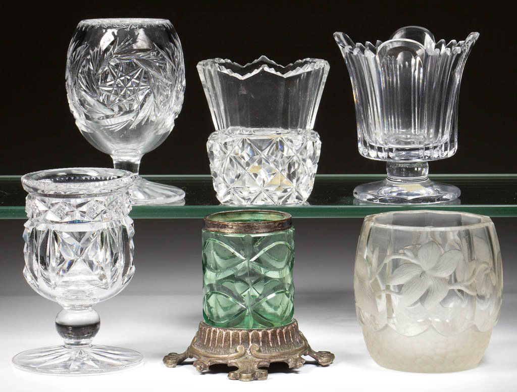 ASSORTED CUT GLASS TOOTHPICK HOLDERS, LOT OF SIX: ASSORTED CUT GLASS TOOTHPICK HOLDERS, LOT OF SIX, colorless and green, including a signed Hawkes pedestal example and a Lockport example. Fourth quarter 19th century. 2 1/2" to 3 1/8" H. Provenance: T