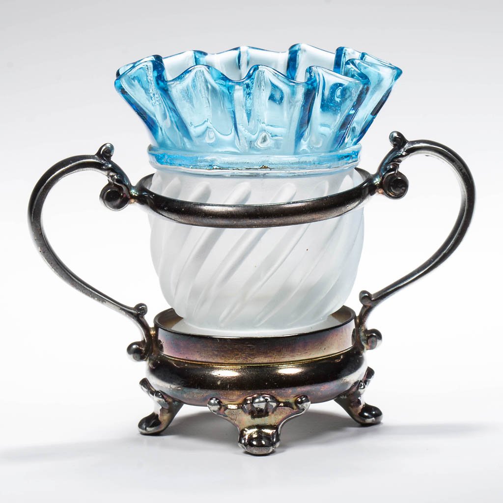 ADONIS (OMN) / GONTERMAN SWIRL TOOTHPICK HOLDER: ADONIS (OMN) / GONTERMAN SWIRL TOOTHPICK HOLDER, colorless with frosted bottom, blue-top, fitted with Rockford quadruple-plate base numbered "1." Aetna Glass & Manufacturing Co. Circa 1888. 3 1/4" HOA