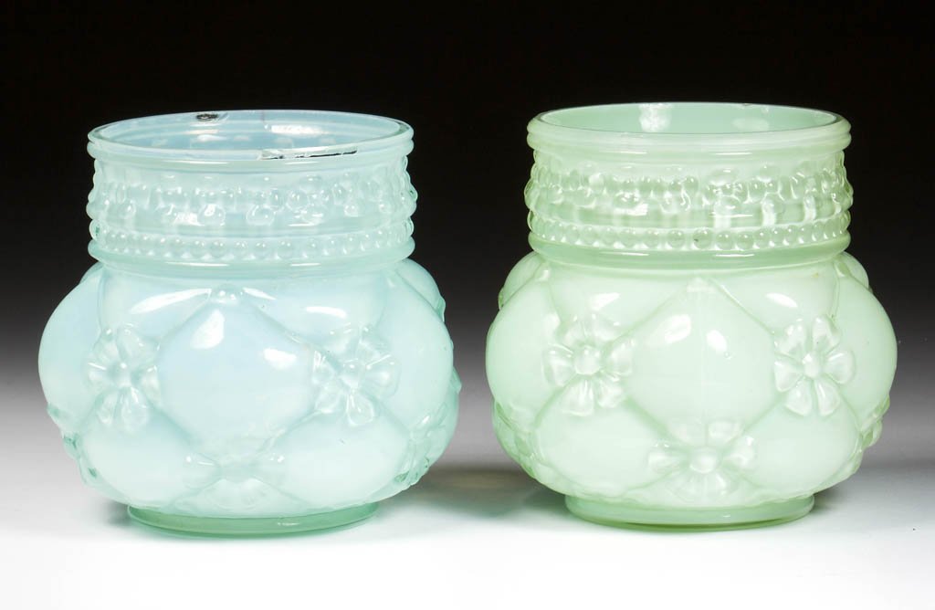 QUILTED PHLOX TOOTHPICK HOLDERS, LOT OF TWO: QUILTED PHLOX TOOTHPICK HOLDERS, LOT OF TWO, two shades of cased green, each with a factory polished rim. Northwood Glass Co. Circa 1900. 2 1/2" H. Literature: Parallels Bredehoft/Sanford - Glass Toot