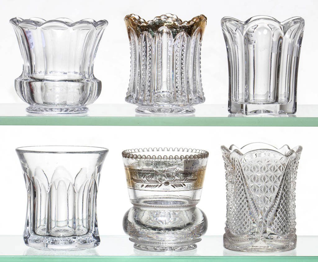 ASSORTED HEISEY TOOTHPICK HOLDERS, LOT OF SIX: ASSORTED HEISEY TOOTHPICK HOLDERS, LOT OF SIX, colorless, including a Continental, a Fandango, a Paneled Can, and a Plain Band example. A. H. Heisey & Co. Circa 1896-1903. 2 1/4" to 2 1/2" H. Literatu