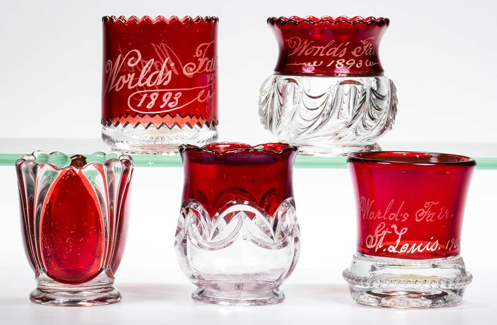 ASSORTED U. S. GLASS - RUBY-STAINED TOOTHPICK HOLDERS,: ASSORTED U. S. GLASS - RUBY-STAINED TOOTHPICK HOLDERS, LOT OF FIVE, colorless, comprising a Double Arch, a Millard, a Saxon, a Scalloped Swirl, and a Washington example. U.S. Glass Co. Circa 1891-1901