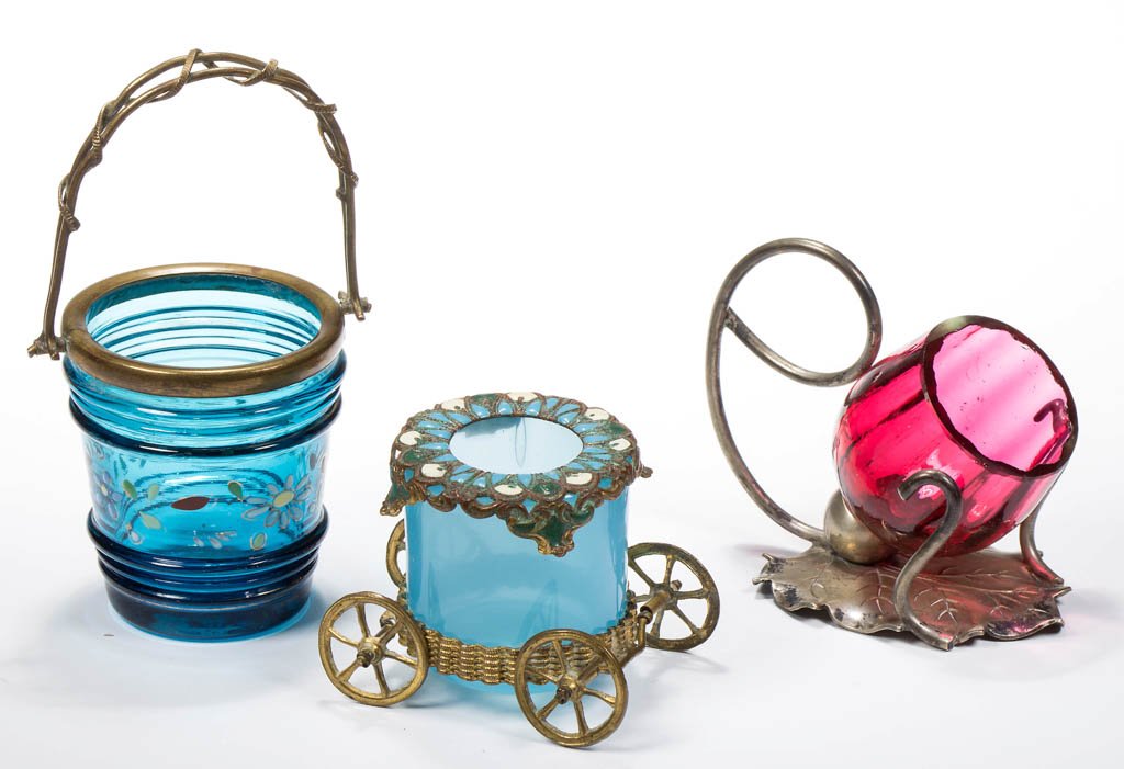 ASSORTED NOVELTY TOOTHPICK HOLDERS, LOT OF THREE: ASSORTED NOVELTY TOOTHPICK HOLDERS, LOT OF THREE, cranberry and blue, comprising a basket with brass fitting and applied wire decoration, a carriage with paint decorated metal fittings, and a Rib-Opti